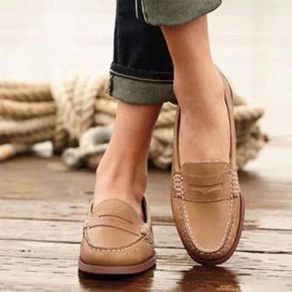 Women's tan moc toe slip-on loafers with decorative saddle strap for effortless everyday style