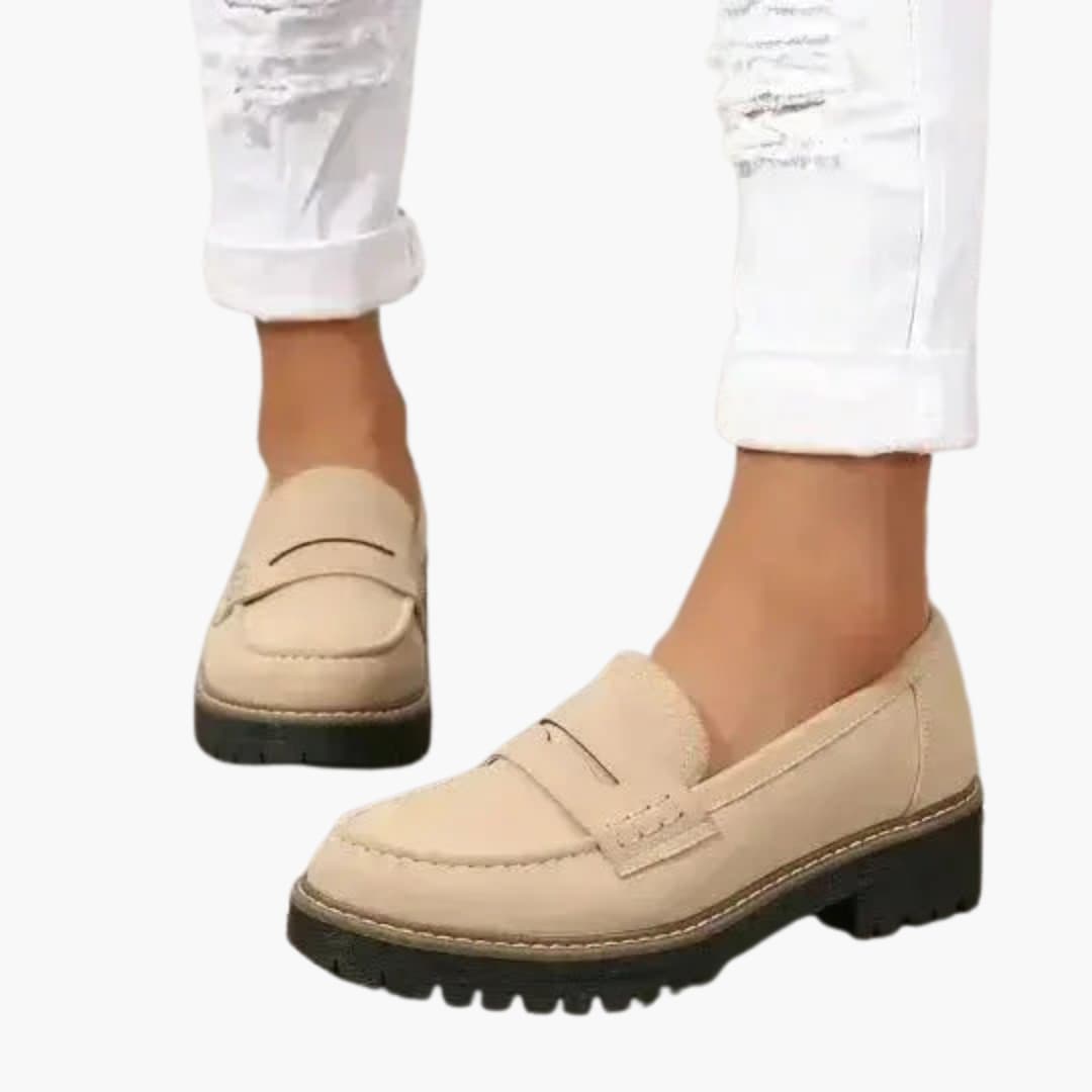 Women's slip-on moccasins with thick textured sole, rounded toe, and subtle topstitching for all-day comfort