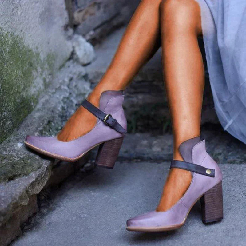 Black leather-look block heel pumps with adjustable Mary Jane strap, elegant women's formal style