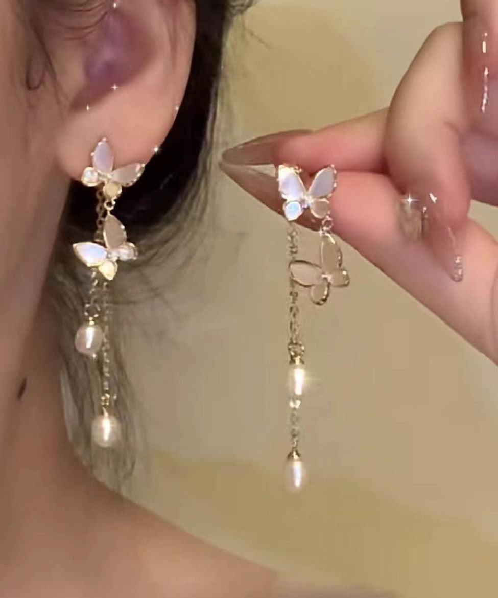 Boucles d'oreilles pendantes modernes en alliage de cuivre doré et perles, motif papillon et pompon - Urbann-Vibe