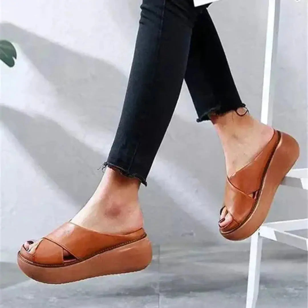 Women's beige leather X-strap platform slides with cushioned wedge footbed for everyday comfort
