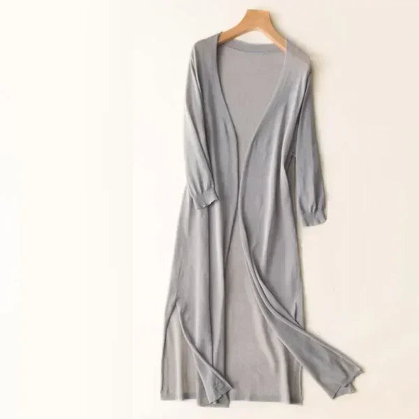 Women's lightweight open-front knit cardigan poncho in neutral tone, relaxed draped silhouette