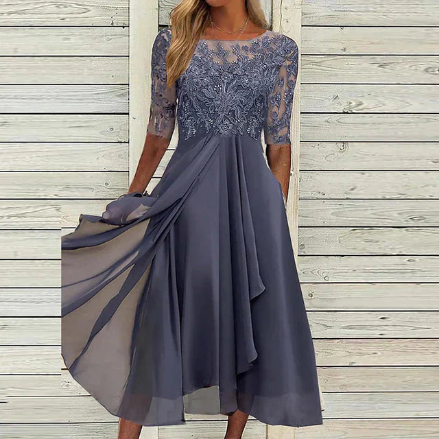 Blush flowy midi dress with lace half sleeves and layered skirt for wedding guests