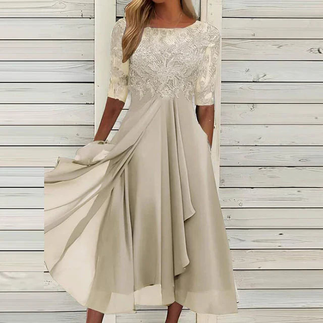 Blush flowy midi dress with lace bodice, half sleeves, and layered skirt for wedding guests