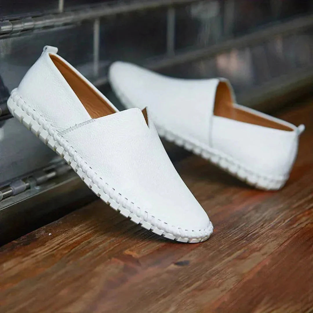 Men's brown textured faux leather slip-on loafer with cushioned insole and flexible rubber sole