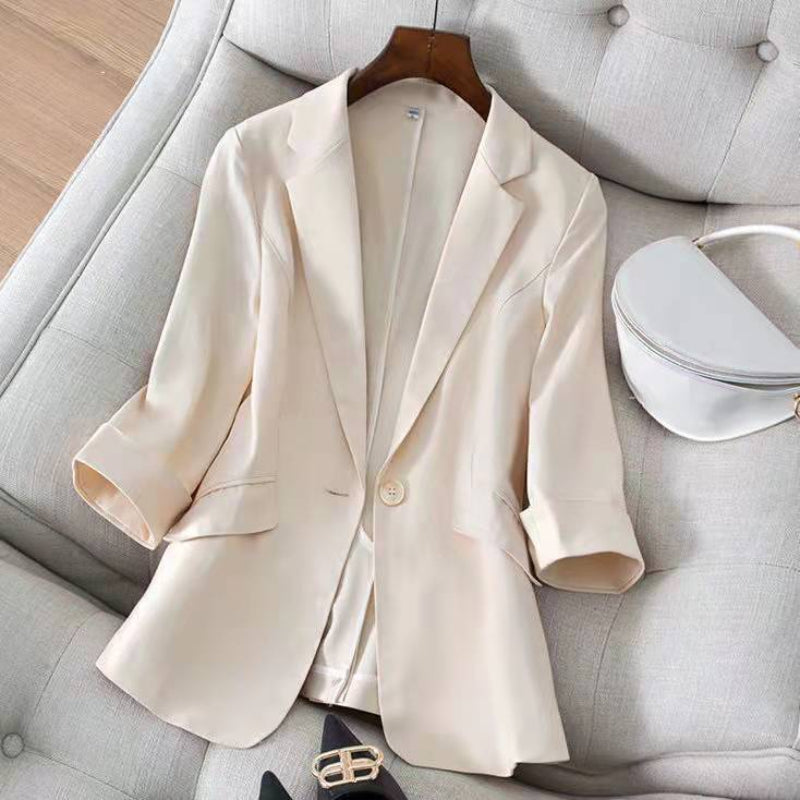 Women's linen blend blazer in neutral tone, rolled sleeves, notch lapel, minimalist office-ready silhouette