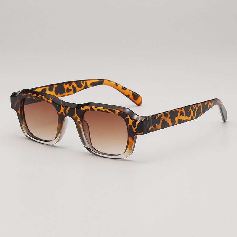 Black bold square sunglasses sleek high-gloss finish UV blocking lenses modern boxy silhouette
