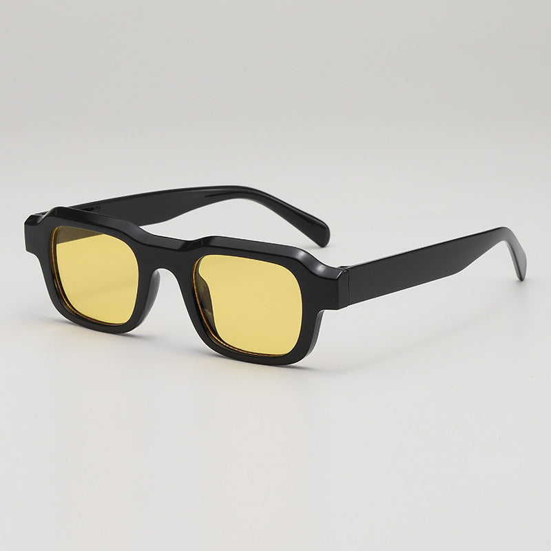 Black bold square sunglasses sleek high-gloss finish UV blocking lenses modern boxy silhouette