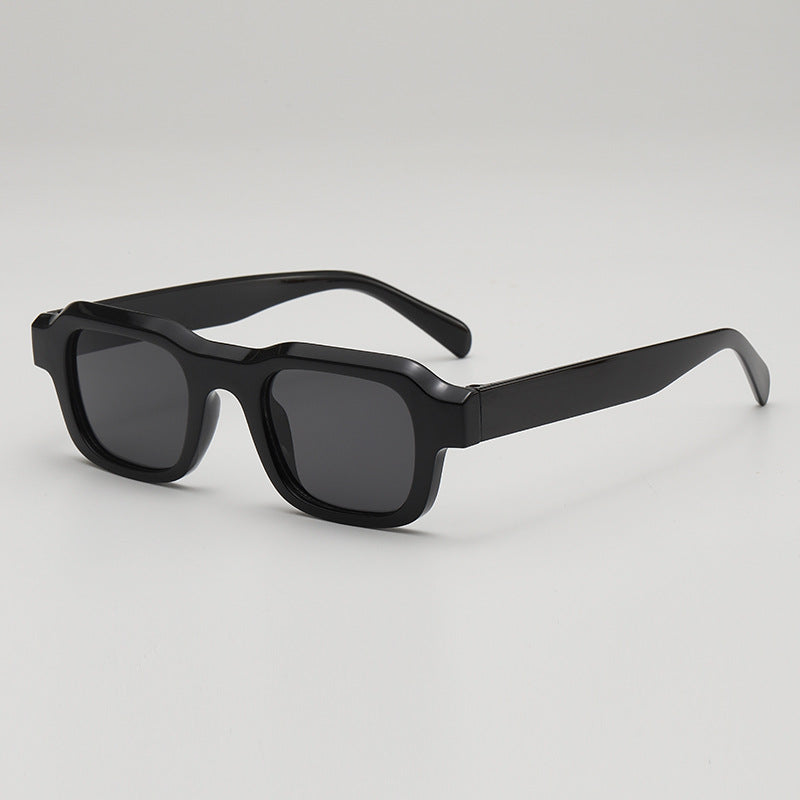 Black bold square sunglasses sleek high-gloss finish UV blocking lenses trendy boxy silhouette