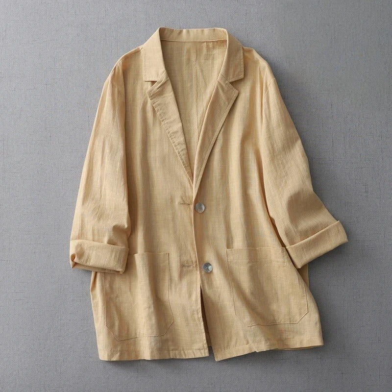 Women's relaxed linen jacket in neutral tone, breezy fit with rolled sleeves and patch pockets