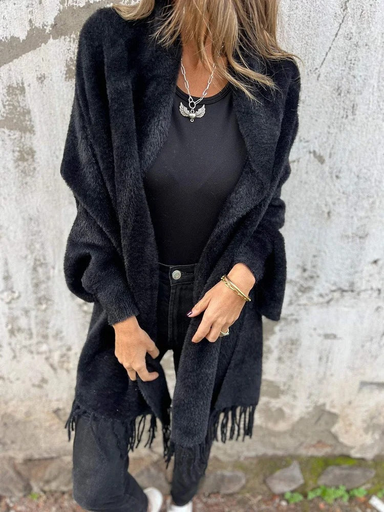 Women's long knit cardigan wrap with soft fringe trim, cozy plush texture, effortless layering style