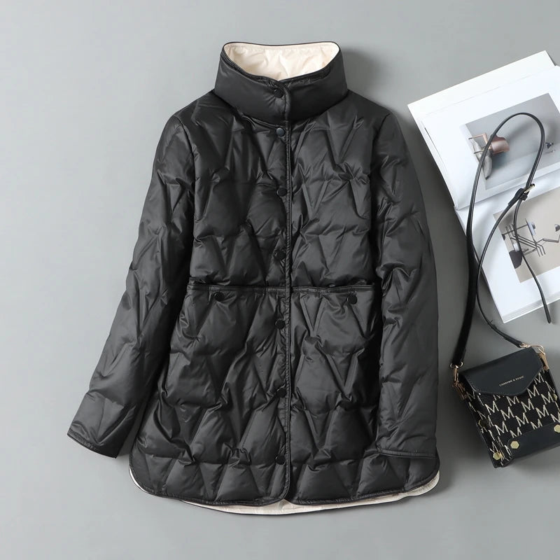 Women's mid-length quilted down jacket in neutral tones with diamond quilt pattern and snap closures