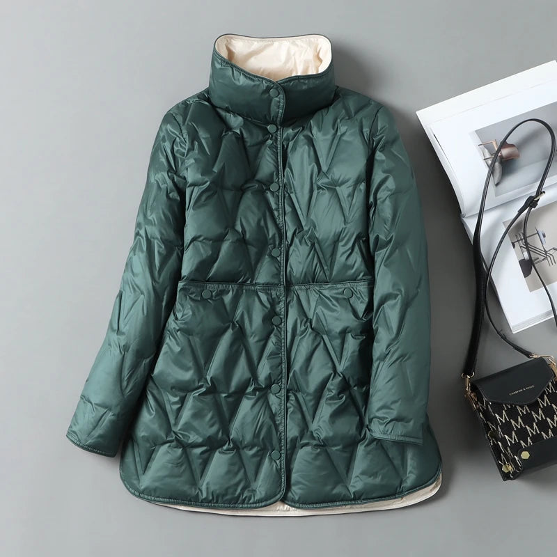 Women's mid-length quilted down jacket in neutral tones with diamond quilt pattern and snap closures