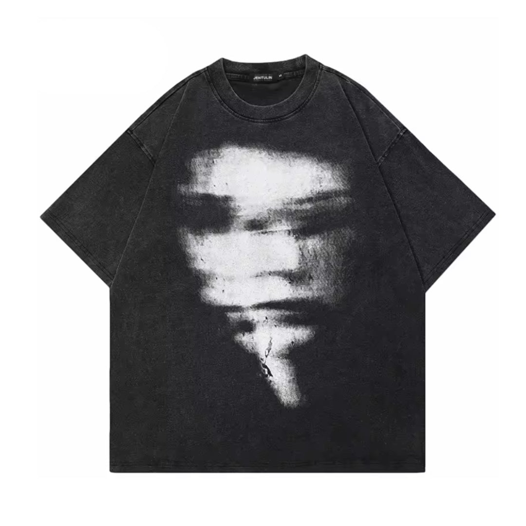 Oversized washed black cotton tee with hazy face print, relaxed streetwear drape for everyday style