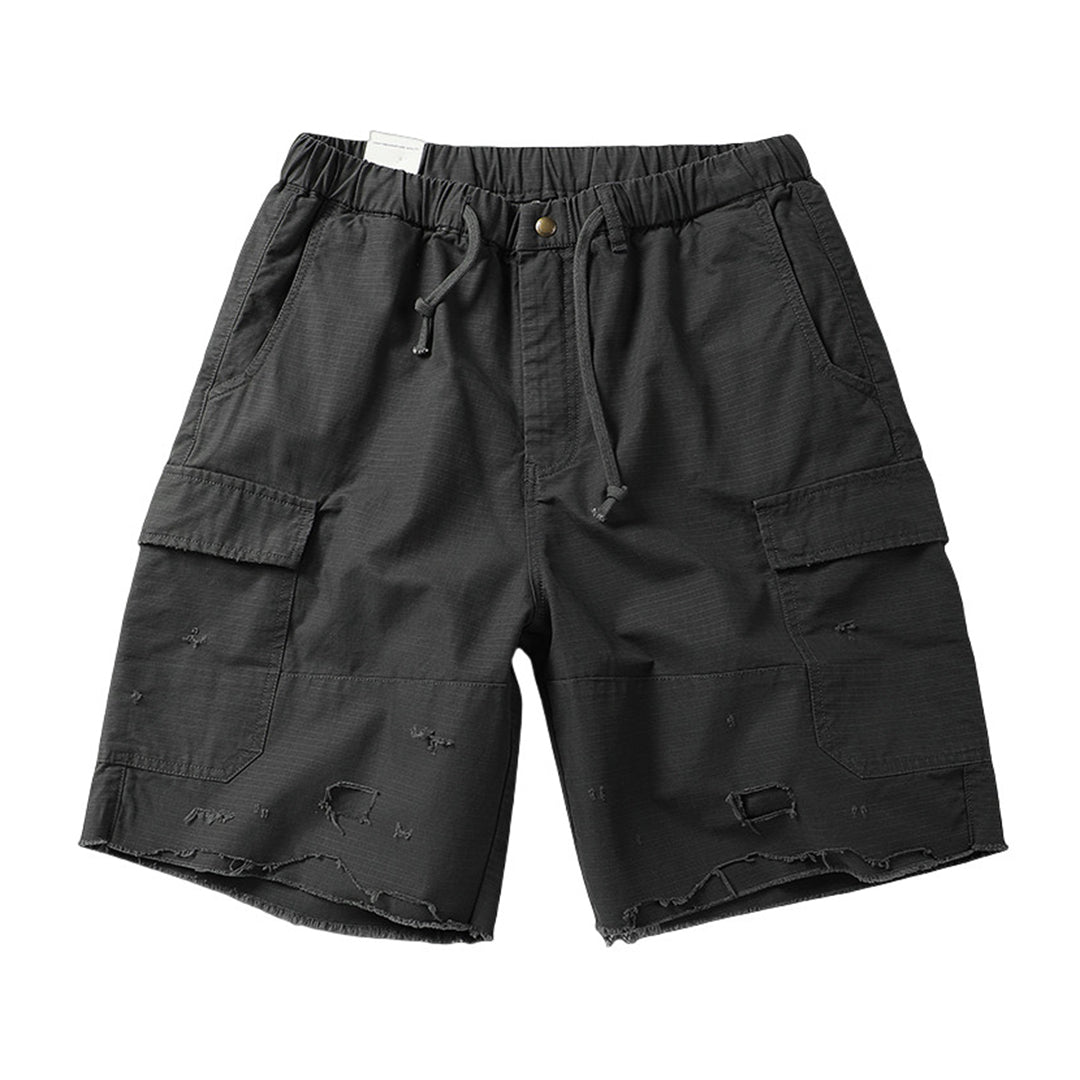 Men's camo cargo shorts in safari green with raw edge hem details and premium cotton construction