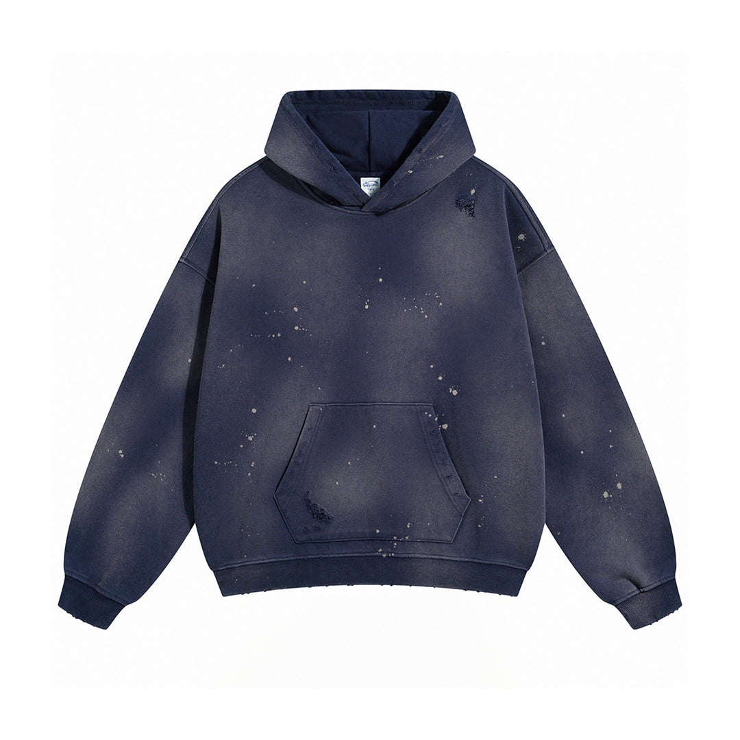 Oversized heavyweight cotton hoodie with bleach drip paint splatter distressing, streetwear style
