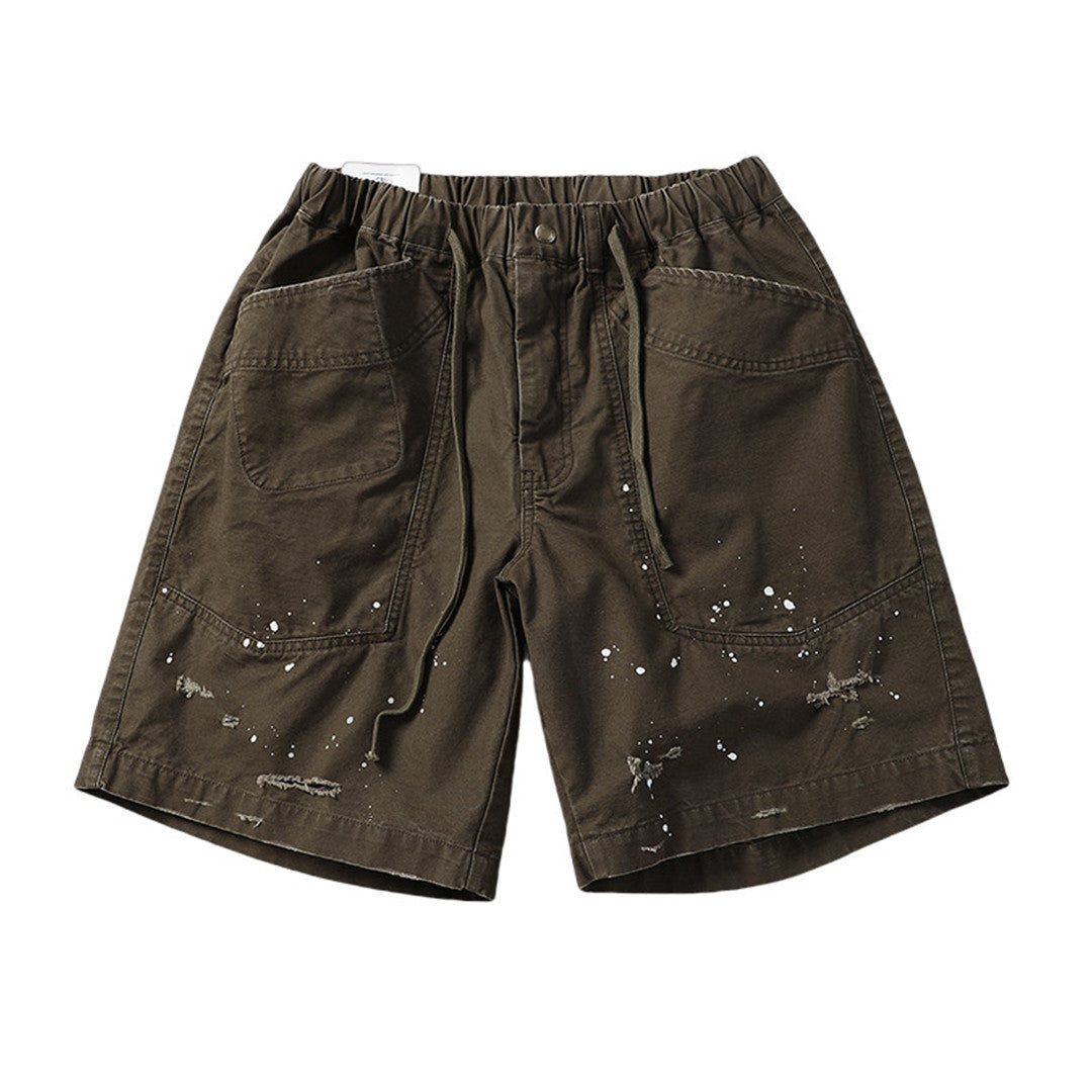 Men's splash ink cargo shorts with ripped details, elastic waist, wide leg streetwear style