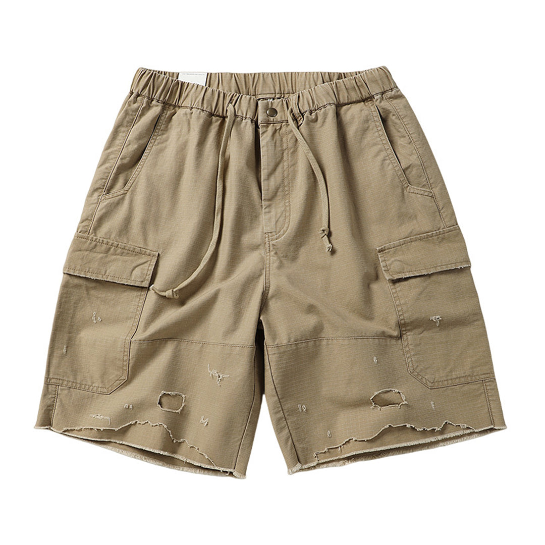 Men's safari camo cargo shorts in premium cotton with rugged raw-edge details and military-inspired cut