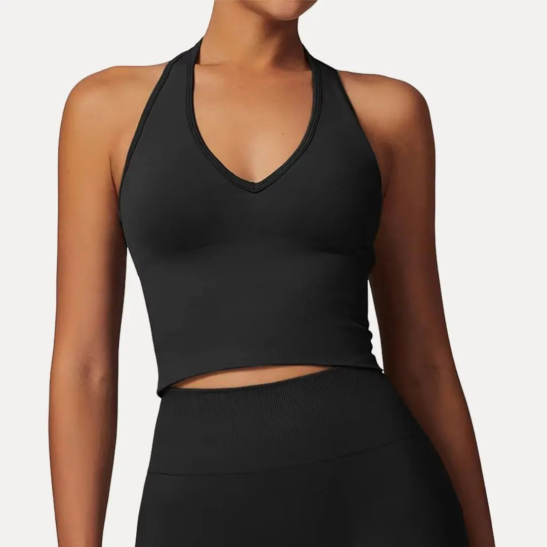 Black seamless halter neck crop tank top with push-up support and breathable stretchy fabric