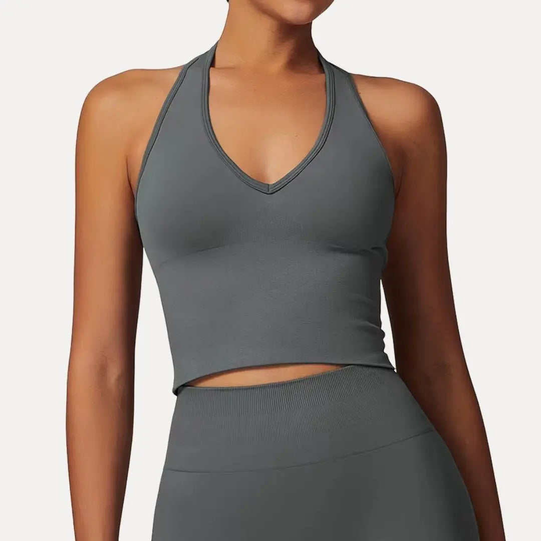 Black seamless halter neck crop tank top with push-up support and breathable stretchy fabric