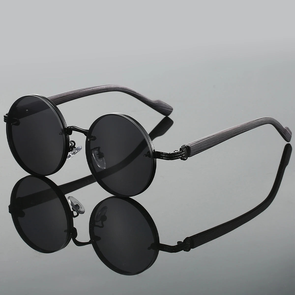 Nova Noir matte black round sunglasses with UV400 circular frames, retro minimalist style for trendsetters