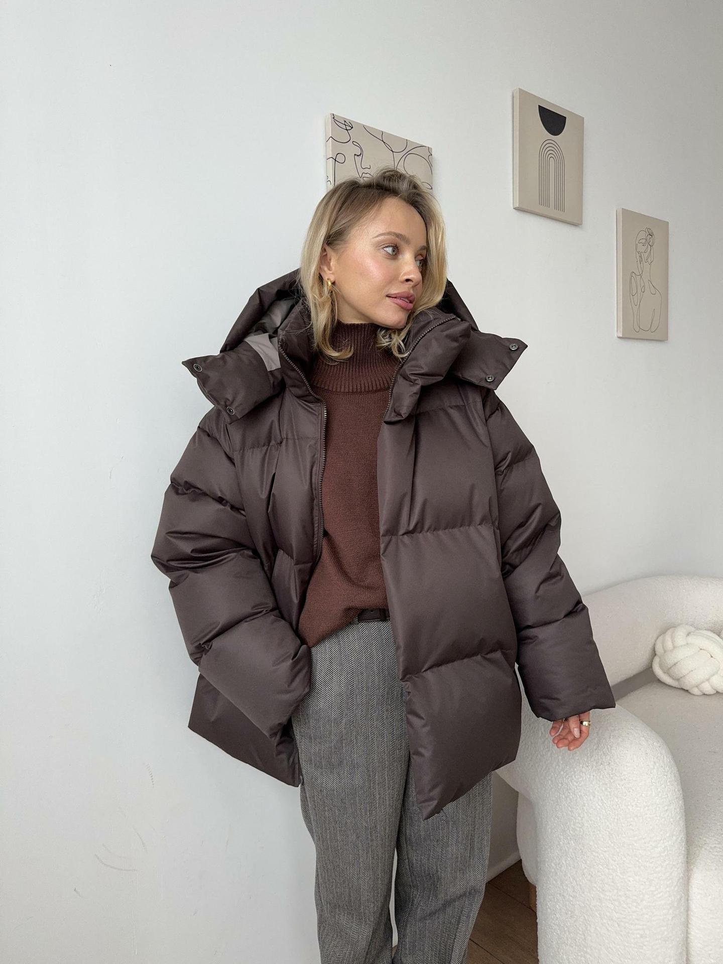 Women's relaxed-fit puffer jacket with high collar, ideal for cold-weather city style and layering