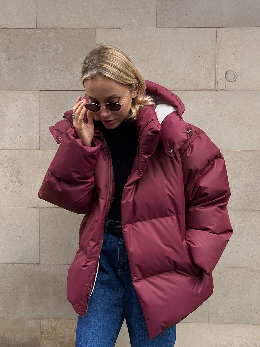 Women's relaxed-fit winter puffer jacket with high collar, ideal for city wear and extra warmth