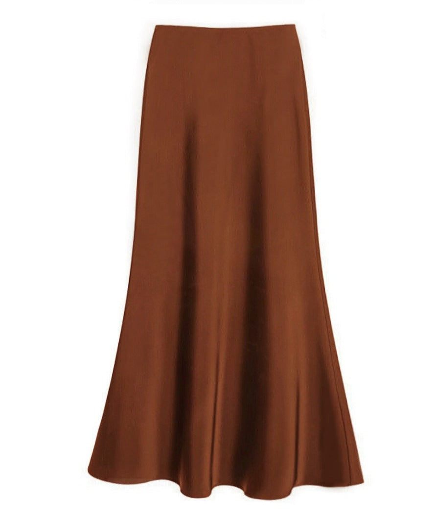 Women's ivory silk maxi skirt with tailored waist, flattering drape, and elegant versatile silhouette