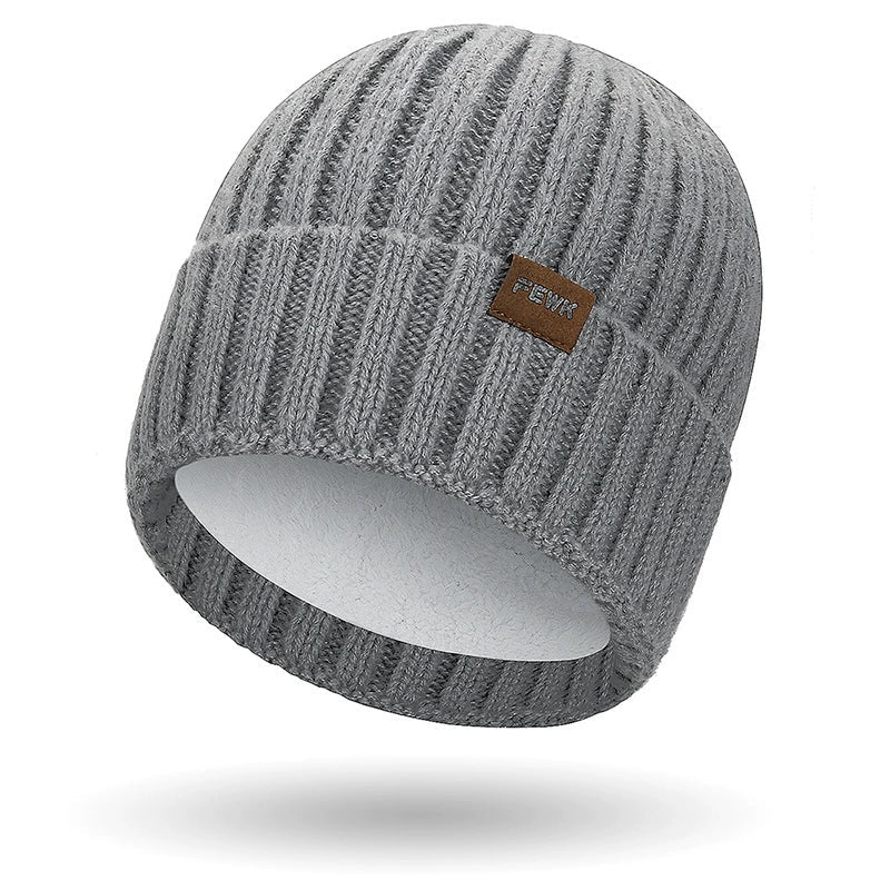 Dark knit unisex beanie with fold-over ribbed cuff and subtle stitched patch for casual wear