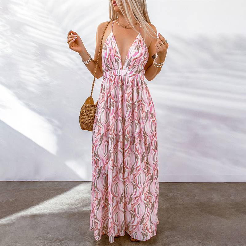 Women's flowy maxi dress deep V-neckline vibrant floral print relaxed silhouette warm-weather style