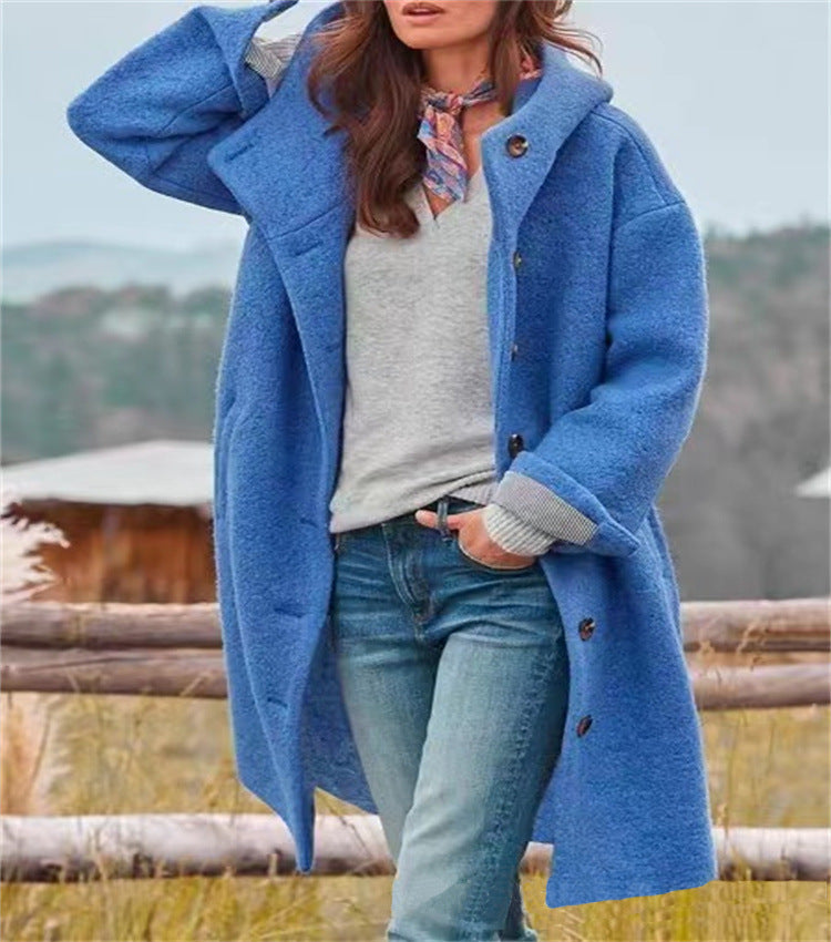 Women's oversized wool coat relaxed silhouette with practical button closure for warmth and everyday elegance