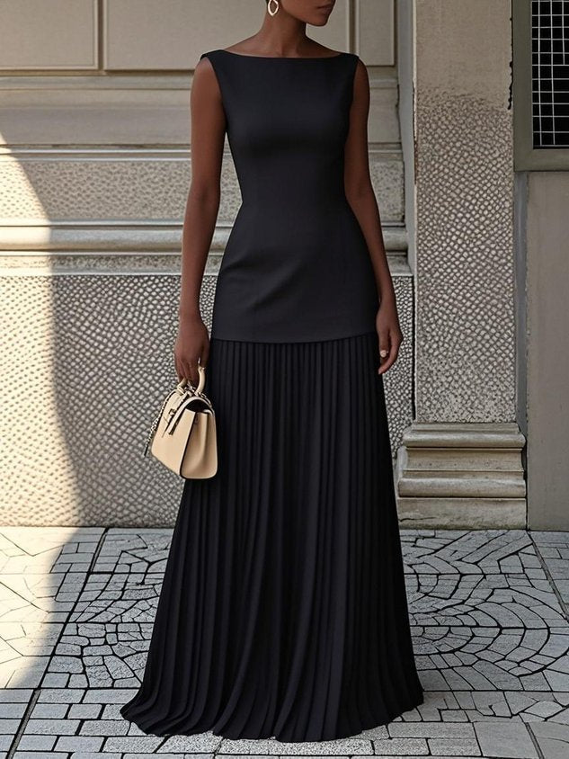 Ivory floor-length evening gown with sculpted bodice and soft pleated skirt for formal occasions