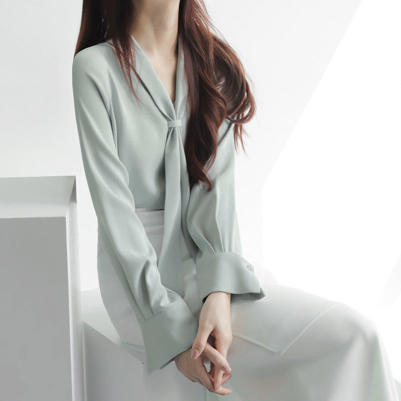 Women's chic tie-neck blouse relaxed fit elegant casual work-ready layering piece with feminine bow detail