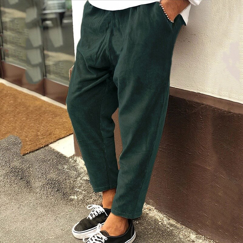 Men's relaxed fit corduroy trousers in neutral tone, casual office style with soft durable fabric