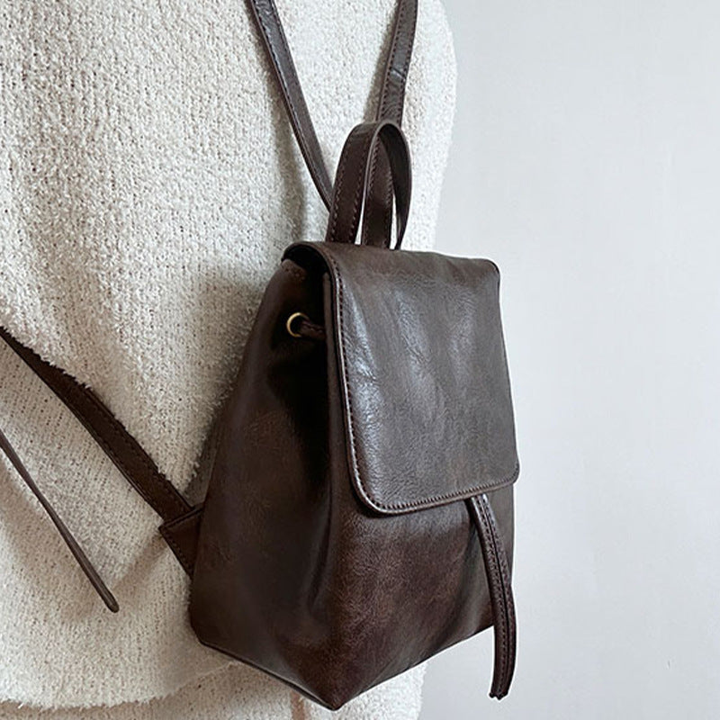 Retro brown PU leather compact backpack with vintage-inspired design for urban everyday use