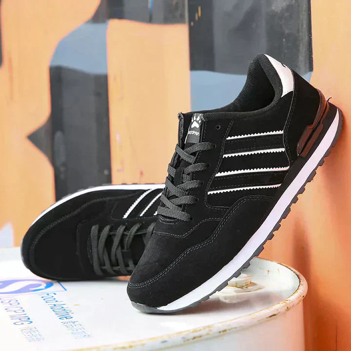 Men's classic white low-top sneakers with cushioned support and timeless casual silhouette