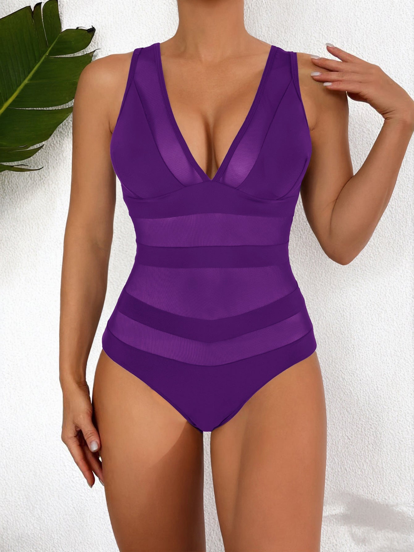 Women's form-fitting one-piece swimsuit deep V-neck mesh panel high-cut leg sleek beach style