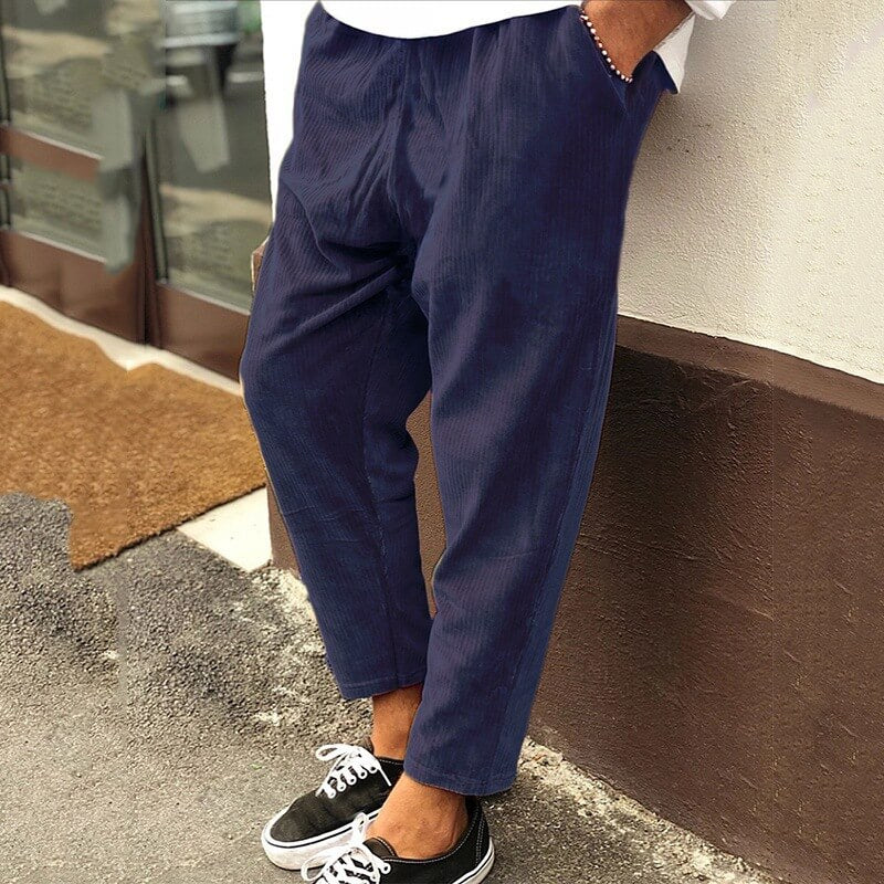 Men's relaxed fit corduroy trousers in neutral tone, soft durable fabric for casual office wear