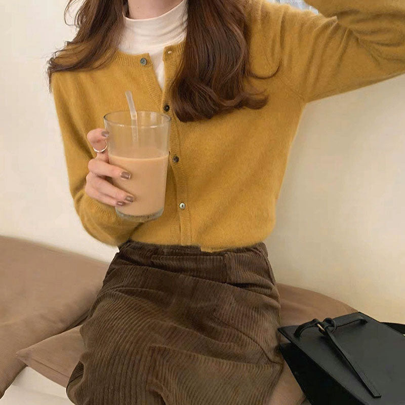 Women's relaxed fit soft knit cardigan with button front closure and ribbed trim for cozy layering