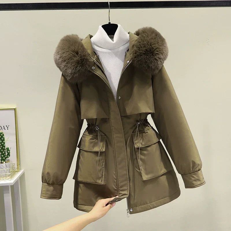 Women's tailored parka jacket with faux fur hood, quilted lining, and zip front closure