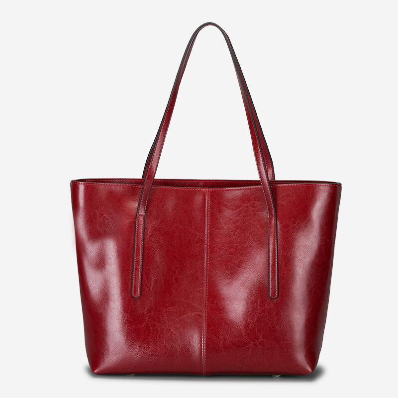 Andrea structured leather tote bag smooth finish slim straps spacious open interior everyday use