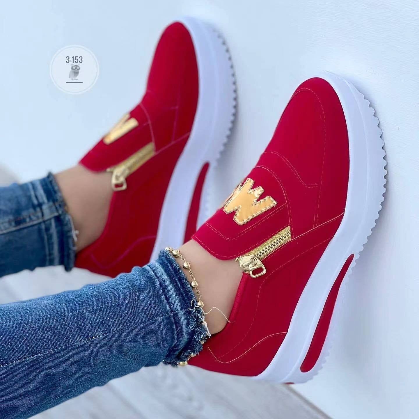 Women's low-top sneakers with suede panels, gold zipper accent, and thick comfort sole