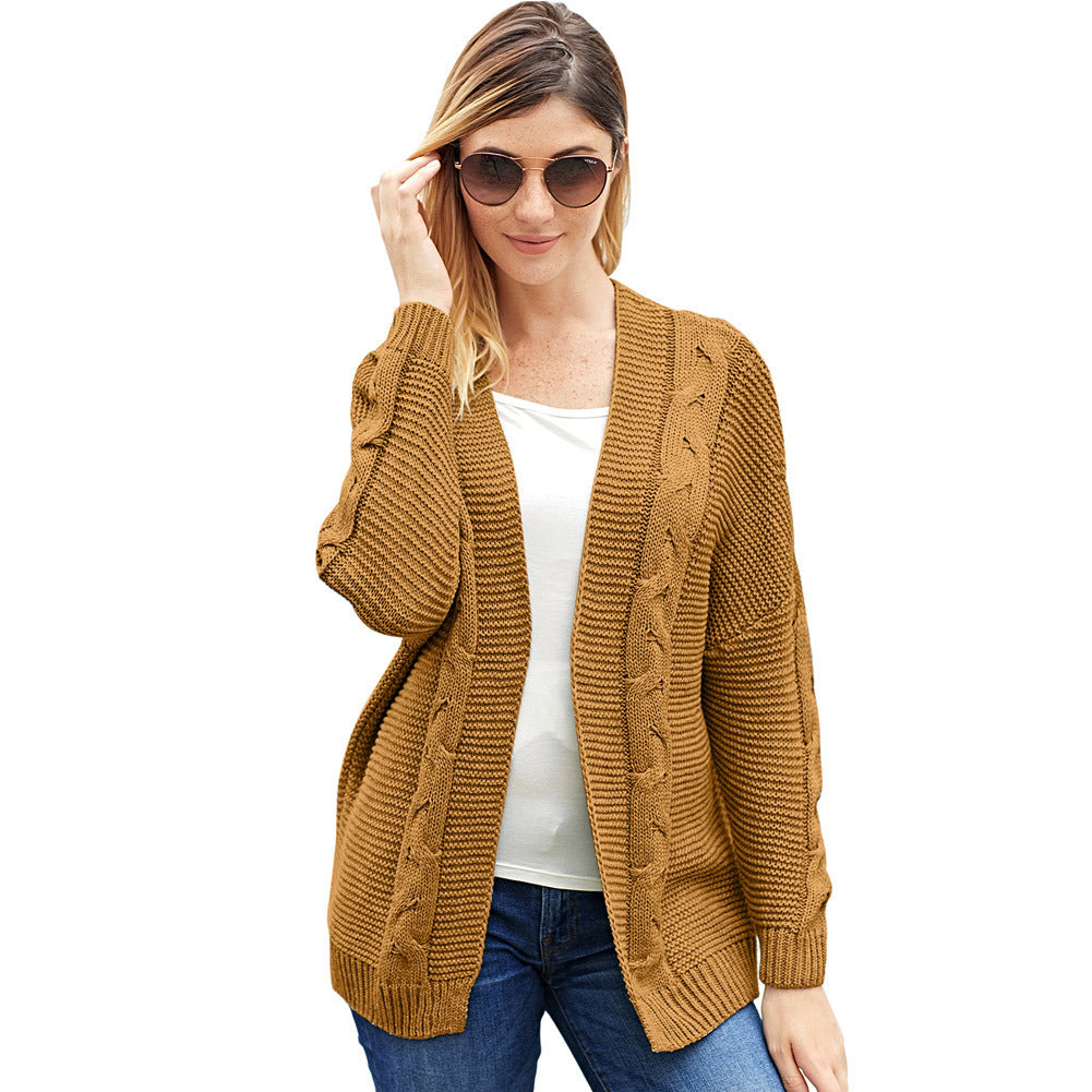Women's oversized open-front cable knit cardigan in cozy chunky texture for effortless layering