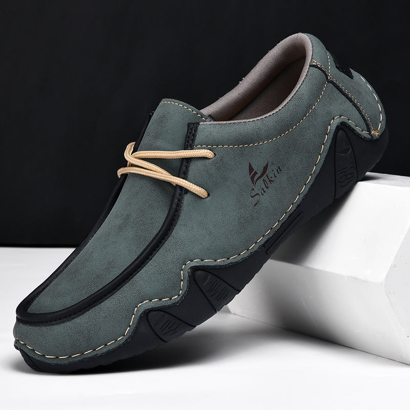 Textured two-tone leather loafers for men with cushioned insole and flexible sole, modern professional style