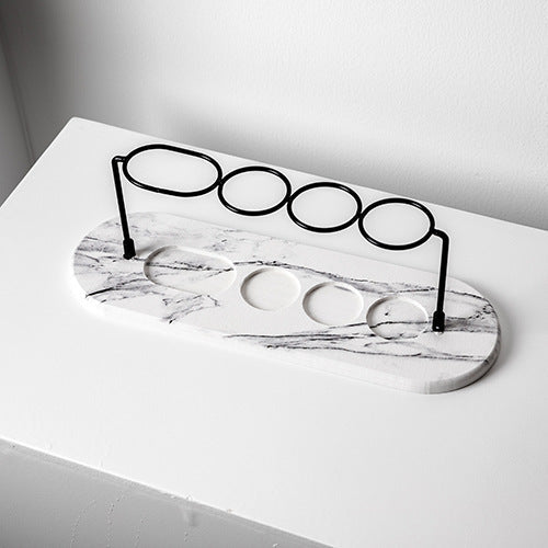 Minimalist marble base toothbrush holder with modern design, keeps bathroom sinks organized and clutter-free