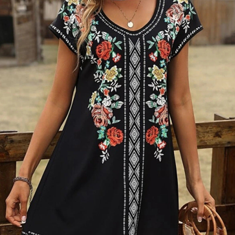 Women's relaxed-fit cotton tunic dress with V-neck, short sleeves, and floral embroidery detail