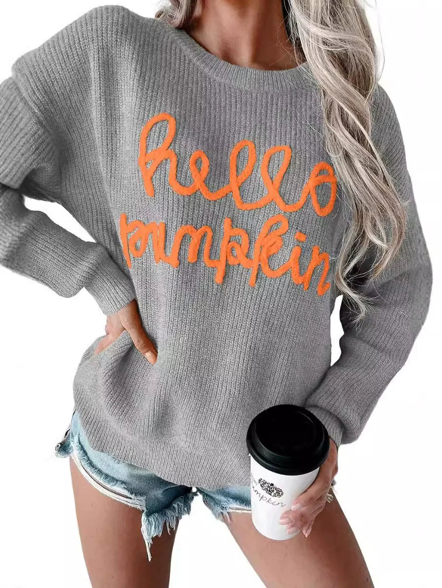 Women's wool blend relaxed fit sweater with ribbed texture and subtle letter detail