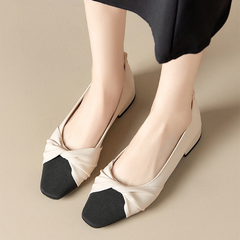 Women's low heel pointed toe pumps in soft PU leather with elegant twist detail for polished style