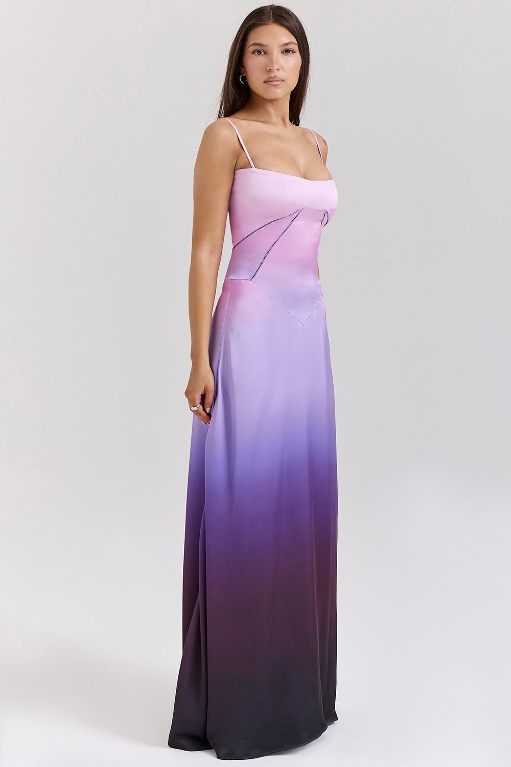 Women's satin A-line long dress with spaghetti straps and cut-out waist detail for evening glamour
