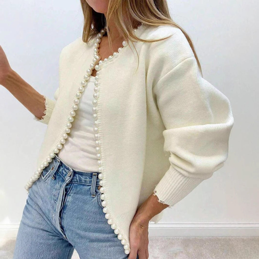 Women's relaxed fit soft knit cardigan with pearl button front closure and long sleeves
